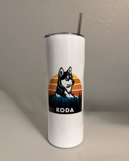White tumbler with a dog illustration and 'KODA' text on a plain background