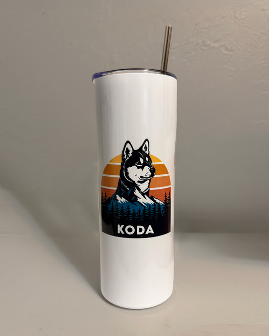 White tumbler with a dog illustration and 'KODA' text on a plain background